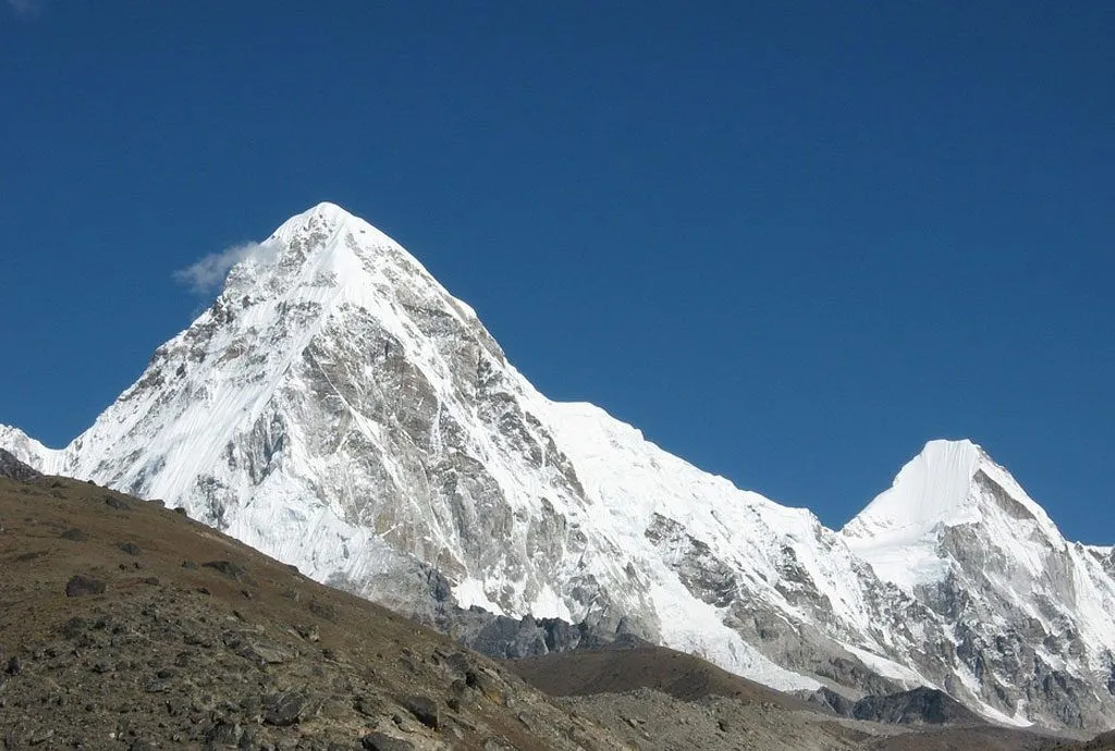 Striking Pumori mountain rising beside Mount Everest.
